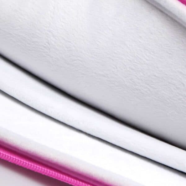 a close-up of a pink and white pillow