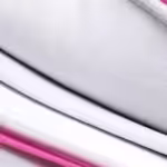 a close-up of a pink and white pillow