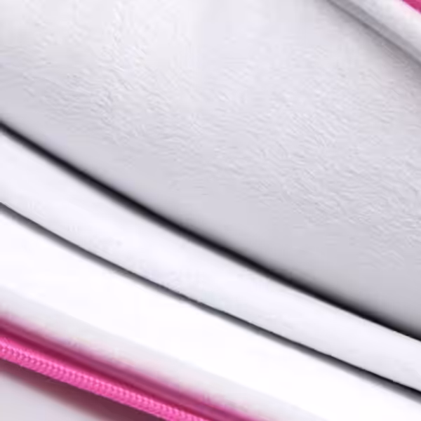 a close-up of a pink and white pillow
